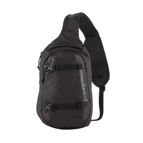 A black Patagonia Atom Sling 8L with adjustable shoulder strap and multiple compartments, designed for close-fitting comfort on a white background.