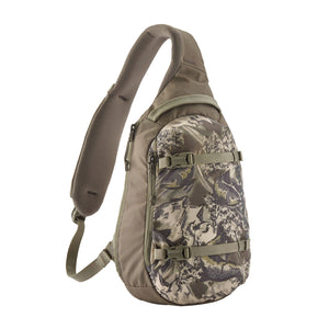 A wing grey and camo pattern Patagonia Atom Sling 8L with adjustable shoulder strap and multiple compartments, designed for close-fitting comfort on a white background.