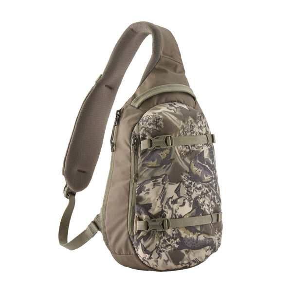 A wing grey and camo pattern Patagonia Atom Sling 8L with adjustable shoulder strap and multiple compartments, designed for close-fitting comfort on a white background.