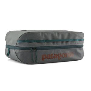 Patagonia Black Hole Cube 14-Liter in Noble Grey with rust red logo on a white background.