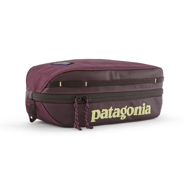 Patagonia Black Hole Cube 3-Liter in Berry Fig with yellow logo on a white background.