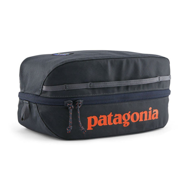 Patagonia Black Hole Cube 6-Liter in Smolder Blue with Orange logo on a white background.