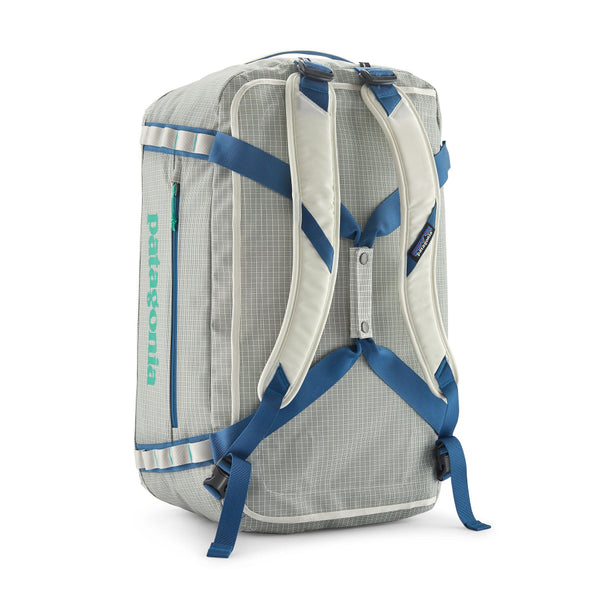 Birch White 55-Liter Patagonia Black Hole Duffel Bag showing convertible backpack straps, on a white background.