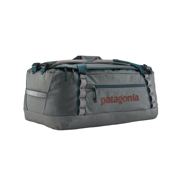 Noble grey 55-Liter Patagonia Black Hole Duffel Bag showing side logo and pocket, on a white background.
