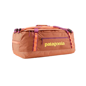 Peach Sherbert color 55-Liter Patagonia Black Hole Duffel Bag showing side logo and pocket, on a white background.