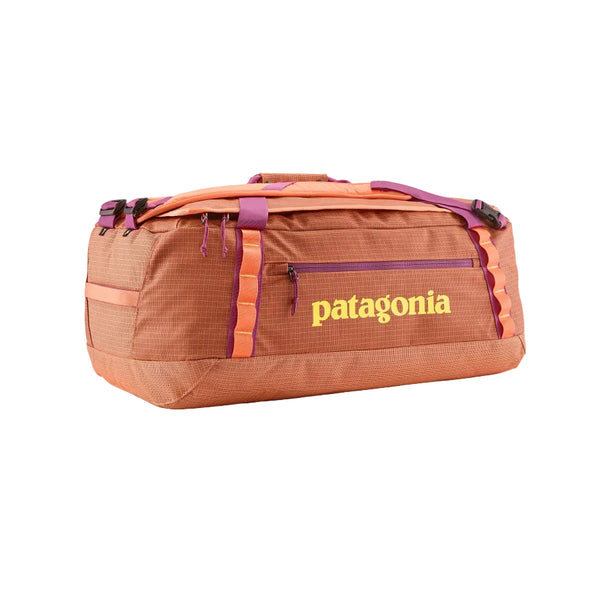 Peach Sherbert color 55-Liter Patagonia Black Hole Duffel Bag showing side logo and pocket, on a white background.