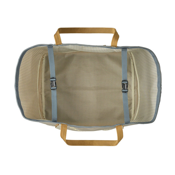 Overhead view of the 61L weathered stone Patagonia Black Hole Gear Tote with tan handles and light blue straps, on a white background.