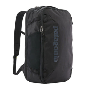 A black Patagonia Black Hole Mini MLC Backpack 30L on a white background.