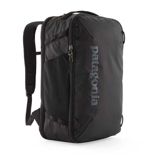 Black Patagonia Black Hole Mini MLC Briefcase Backpack with Patagonia logo on a white background.