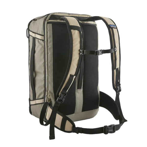 Back view showing straps and waist support of the weathered stone Patagonia Black Hole Mini MLC Backpack 30L on a white background.