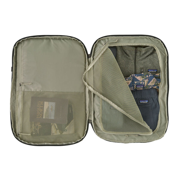 Open showing pockets weathered stone Patagonia Black Hole MLC Briefcase Backpack 45L, on a white background (contents and clothing not included).