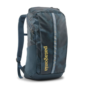 The 25-liter Patagonia Black Hole Backpack in Sastrugi: Summit Blue with light yellow logo and accents, shown from the front on a white background.