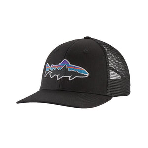 A black Patagonia Fitz Roy Trout Trucker Hat with a fish logo on the front over a white background.