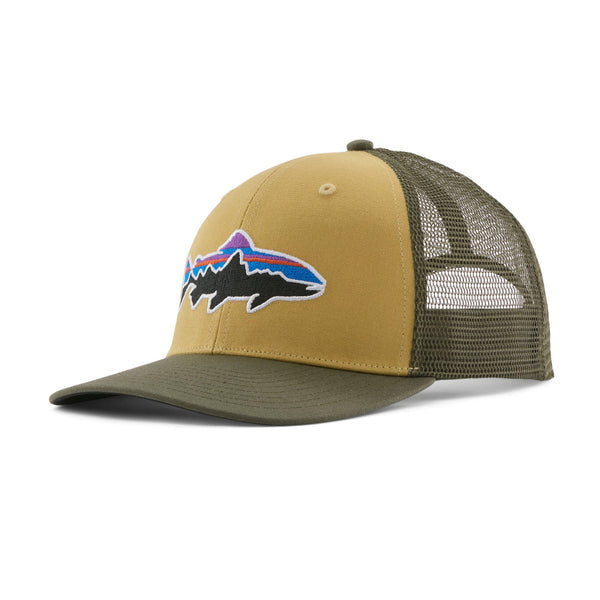 A lynx tan Patagonia Fitz Roy Trout Trucker Hat with a fish logo on the front, over a white background.