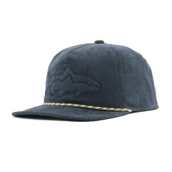 A Patagonia Fly Catcher Trucker Hat featuring a summit blue corduroy front panel, brim, and back panels, and a trout shaped logo patch on the front, on a white background.