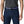 Pearson wearing blue jeans with a grey t-shirt and the Multicolored Fitz Roy design Patagonia Friction Belt with a black buckle on a white background.