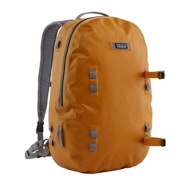 Front view pf the Patagonia Guidewater Waterproof Fishing Backpack in Golden Caramel with Noble Grey Straps and accents on a white background.