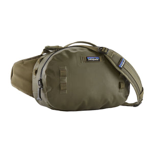 Front view of the Patagonia Guidewater Waterproof Fishing Hip Pack in Basin Green with blue accents on a white background.