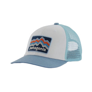 A Patagonia kids' trucker hat with a blue brim and an organic cotton front crown, featuring a recycled polyester mesh back, on a white background,