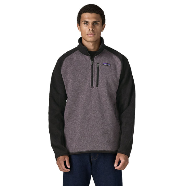 Person wearing jeans and the May grey and black raglan sleeve Patagonia Men's Better Sweater 1/4 Zip Pullover, shown from the front against a white background.