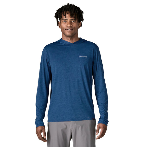 Man wearing a clement blue Patagonia Men's Cap Cool Daily Hoody on a white background.