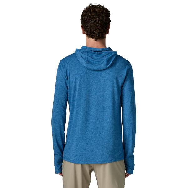 Back view of  a person wearing the aquatic blue Patagonia Men's Capilene Cool Sun Hoody with the cloud crag crest on the zipper pocket front right chest and khaki pants, on a white background.