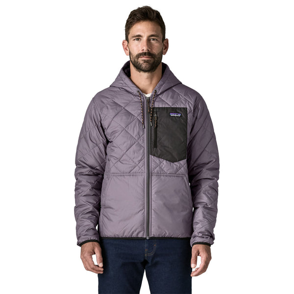 Person wearing the May Grey Patagonia Men's Diamond Quilted Bomber Hoody and jeans, on a white background.