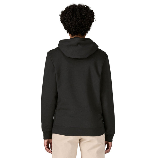 Person wearing the black Patagonia Men's Home Water Trout Uprisal Hoody showing the hood detail against a white background.