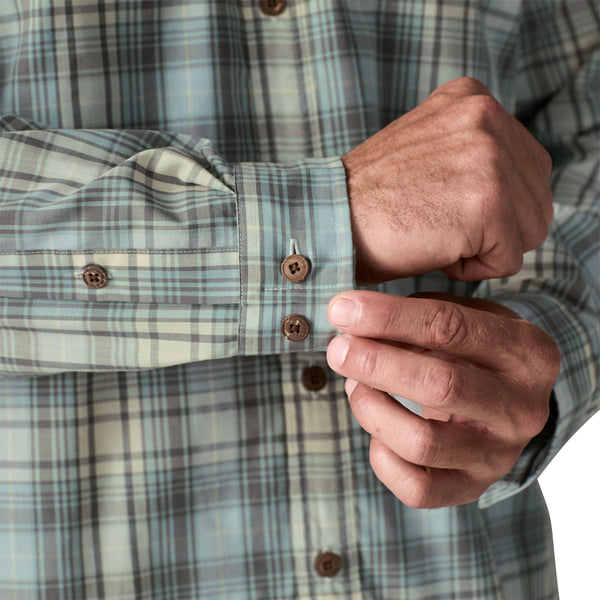 Person wearing the dyno white longshore plaid Patagonia Men's Island Hopper Shirt with buttons on the cuffs closeup.