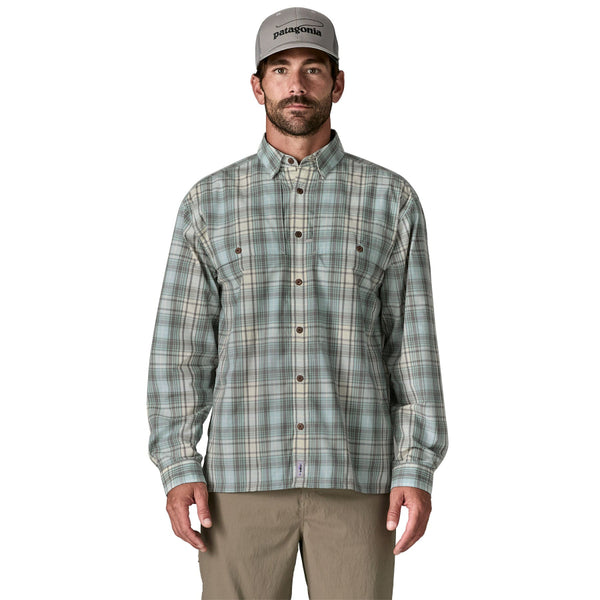 Person wearing the dyno white longshore plaid Patagonia Men's Island Hopper Shirt and tan pants on a white background.