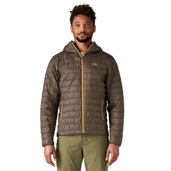 Person wearing the new for 2025 Patagonia Men's Nano Puff Fitz Roy Trout Insulated Hoody in otter brown on a white background.