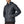Person wearing black pants and a smolder blue Patagonia Men's Nano Puff Insulated Hoody, showing the side zipper pocket details, against a white background.
