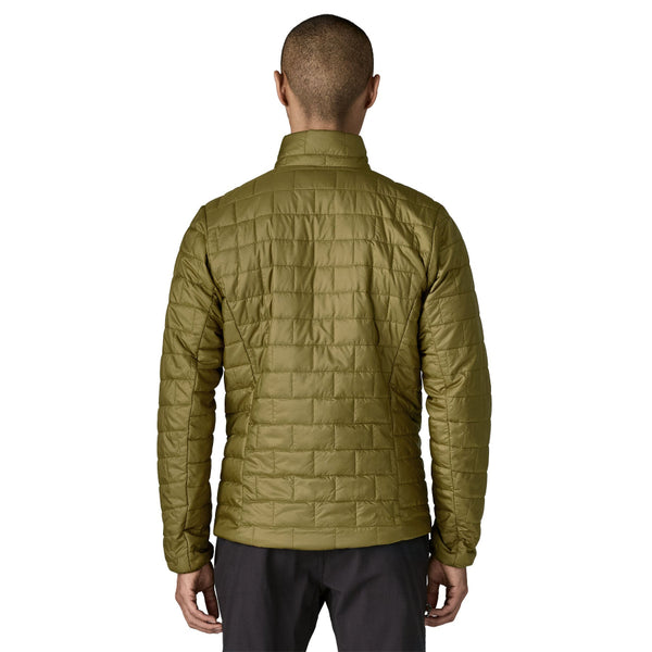 Man wearing the new for 2025 pond green Patagonia Men's Nano Puff Jacket on a white background.