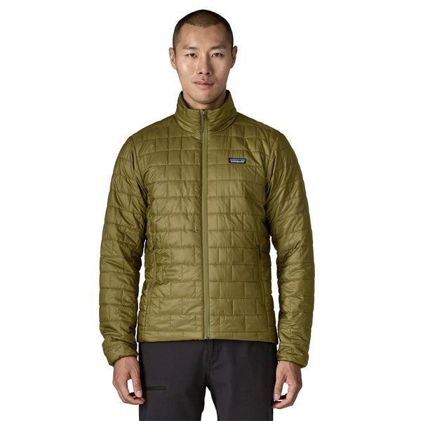 Man wearing the new for 2025 pond green Patagonia Men's Nano Puff Jacket on a white background.