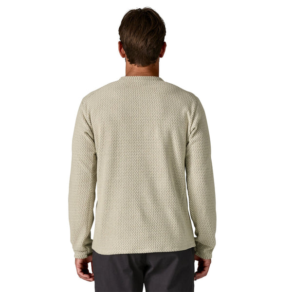 Man wearing a beige R1 Air Fleece long-sleeve shirt from the back on a white background.