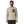 Man wearing a beige R1 Air Fleece long-sleeve shirt with a pocket and Patagonia logo on a white background.