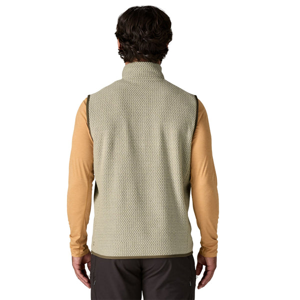 Man wearing a pelican tan Patagonia Men's R1 Air Fleece Vest on a white background.
