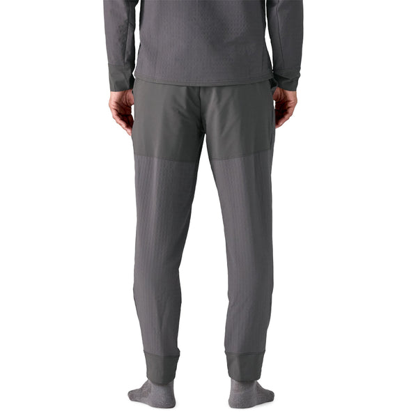 Person wearing the Patagonia Men's R2 TechFace Fleece Lined Pants and matching pullover in forge grey.