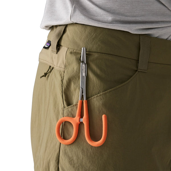 Person wearing sage khaki  Patagonia Men's Sandy Cay Wading Pants showing tool loop details on a white background.