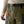 Person wearing a set of Patagonia Men's Swiftcurrent Pant Waders in basin green, showing the belt and tool clip details, on a white background.