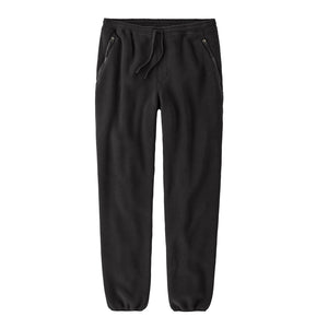 Black solid color Patagonia Men's Synchilla Fleece Pants with an elastic waistband, drawstring, and zippered side pockets, shown flat on a white background.