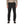 A person wearing a tan long sleeved shirt and lack solid color Patagonia Men's Synchilla Fleece Pants with an elastic waistband, drawstring, and zippered side pockets, against a white background.