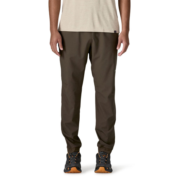 Man wearing Patagonia Men's Terrebonne Joggers in otter brown on a white background.