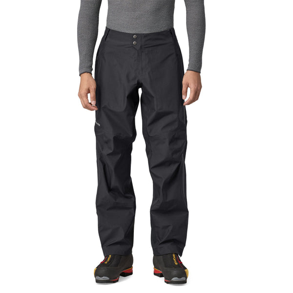 Person wearing black Patagonia Men's Triolet Alpine Pant on a white background.