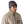 Person wearing colorful fish-patterned Navy Salmon Energy Patagonia Micro D Fleece Beanie on a white background.