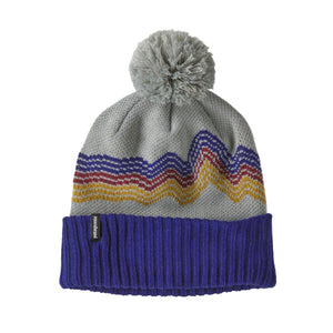 Knitted Patagonia Branded beanie in grey with colorful pattern, pom pom topper, and blue band on a white background.