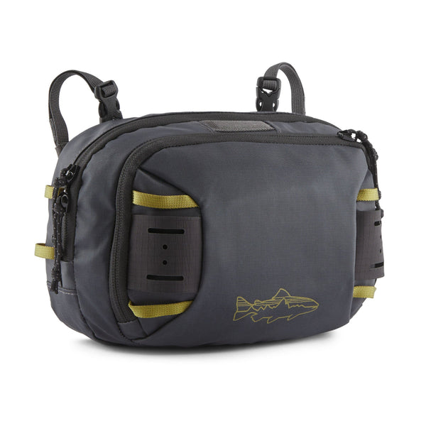 Patagonia Stealth Switch Pack 5L in forge grey with graze green color designed for carrying fishing equipment, on a white background.