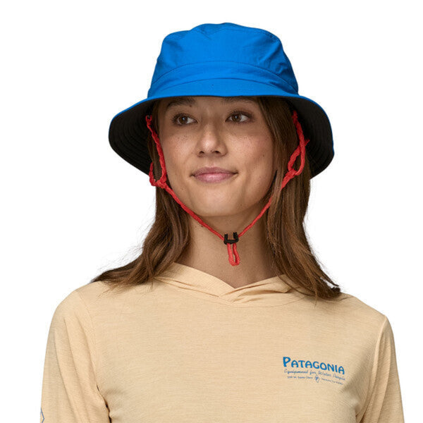 Person wearing the Patagonia Surf Brimmer Bucket Hat in Vessel Blue on a white background.