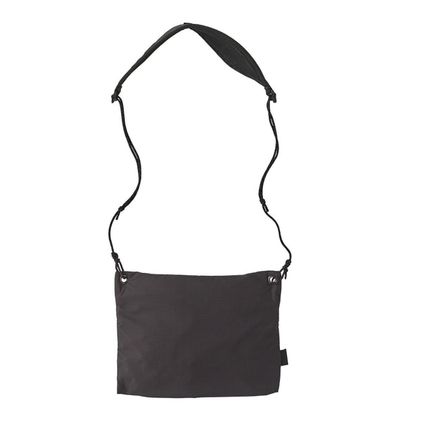 Black Patagonia Terravia Sacoche crossbody bag with extended shoulder strap against a white background.