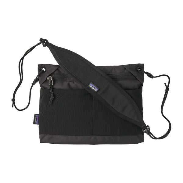 Black Patagonia Terravia Sacoche crossbody bag with a logo on the shoulder strap against a white background.